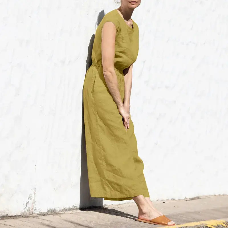 Cotton and linen jumpsuit, olive green, sleeveless with high waist and wide legs.