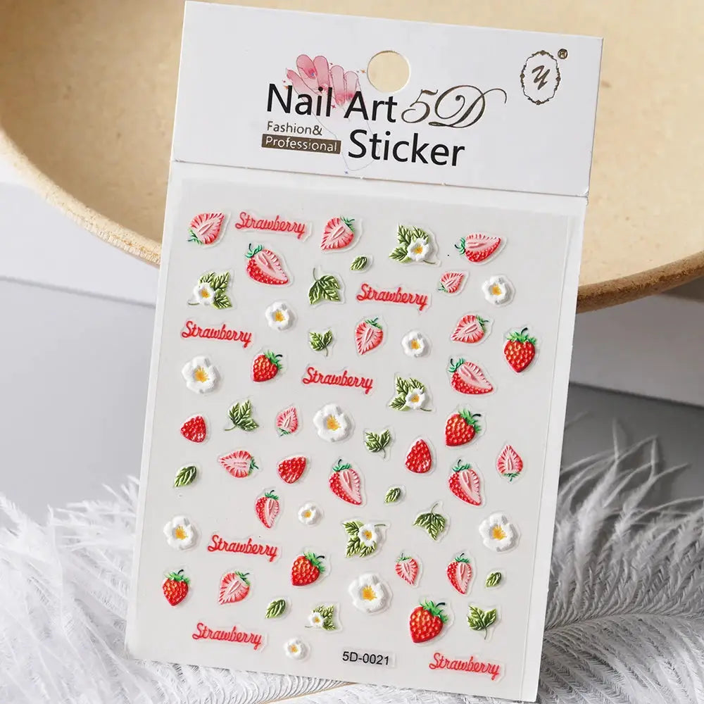 Nail art sticker sheet featuring red strawberries, leaves and small flowers for manicure