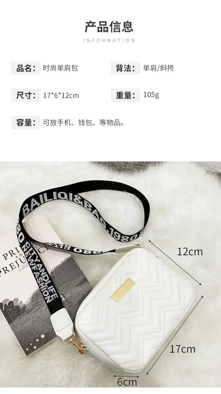 Minimalist white quilted mini crossbody bag by Simples Market with black logo strap and gold hardware.