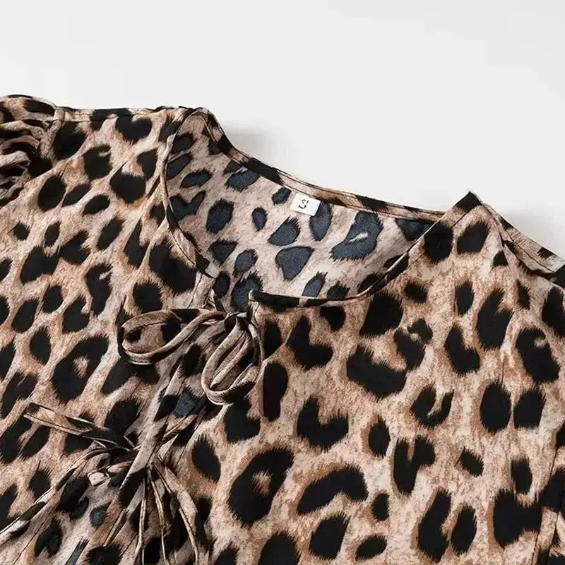 Leopard print women's blouse with tie-front neckline and ruched detailing