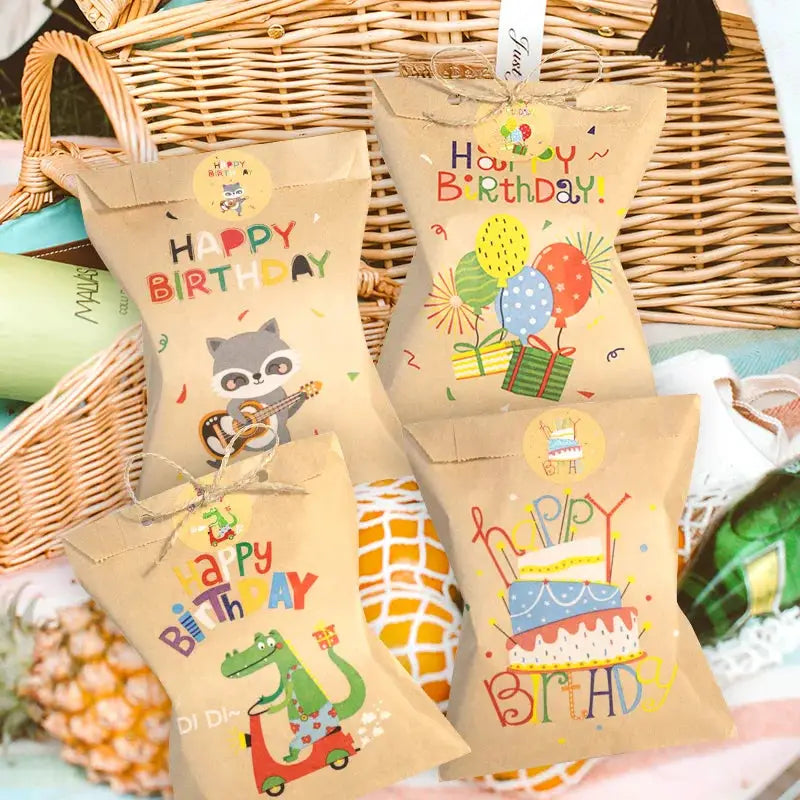 Kraft paper gift bags with colorful birthday designs featuring a rainbow dino, balloons and cake