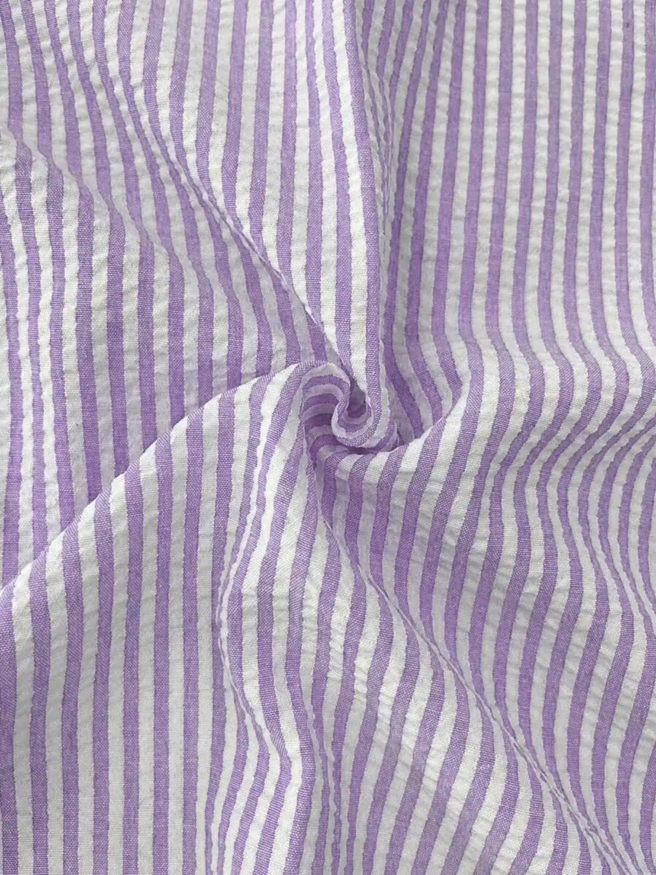 Men's striped shirt fabric close-up in purple and white with seam detail