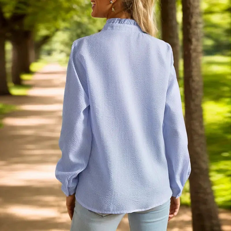 Women's light-blue textured long-sleeve shirt with stand collar, single-breasted, solid color, back view
