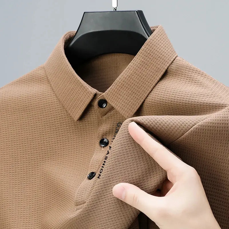 Men's waffle polo shirt in brown with black buttons and vertical letter print on placket.