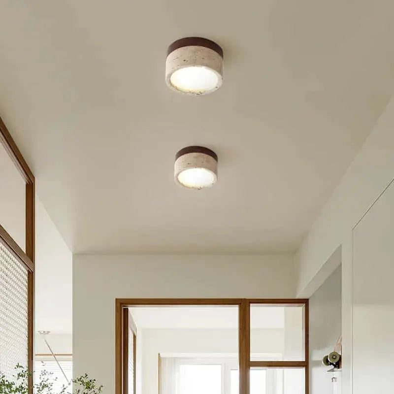 Japanese Wabi Sabi stone LED ceiling light by Simples Market, cream round fixtures; two units in a modern room.