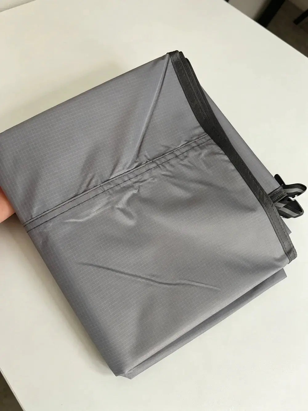 Waterproof camping mat, gray ripstop nylon, ultralight foldable travel pad with straps