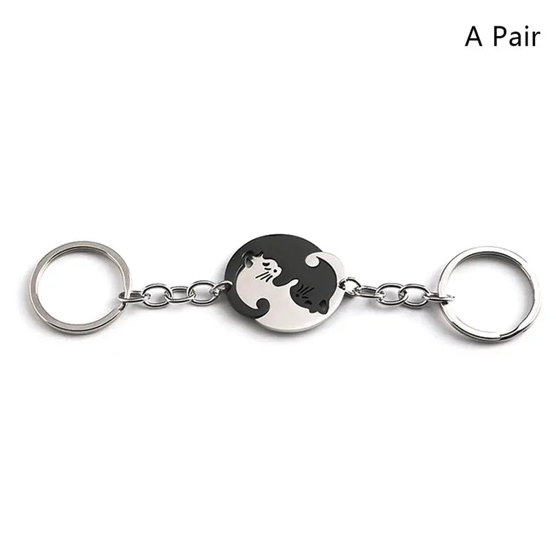Cute cat hug keychain, stainless steel, round heart patchwork with black and white cat design