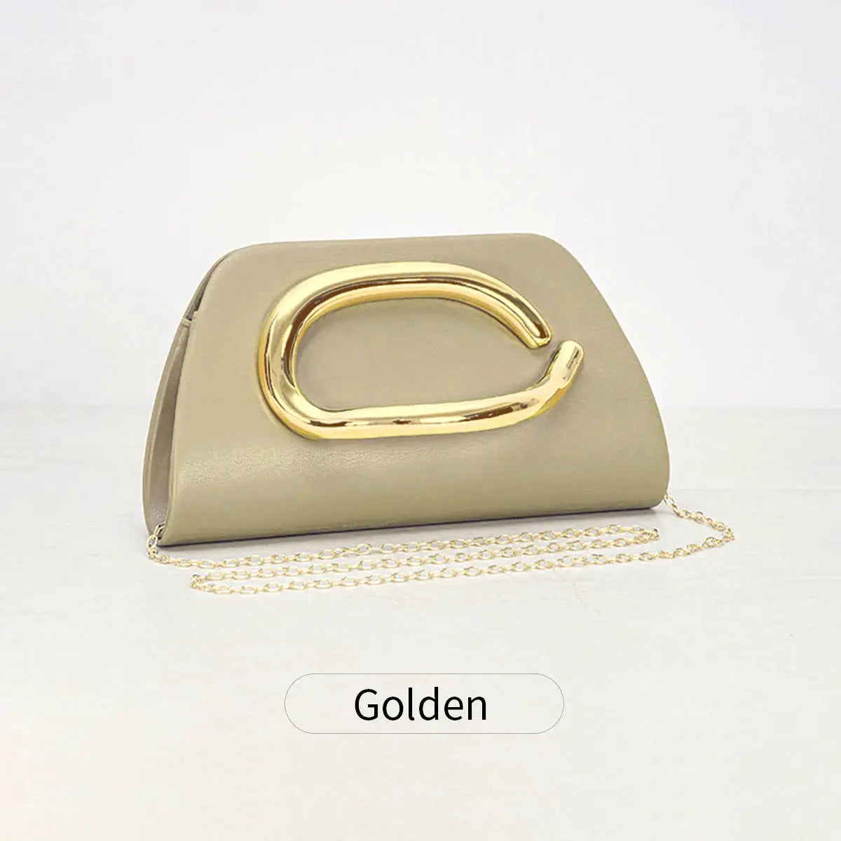 Gold-tone metal buckle box clutch in beige faux leather with a chain crossbody strap