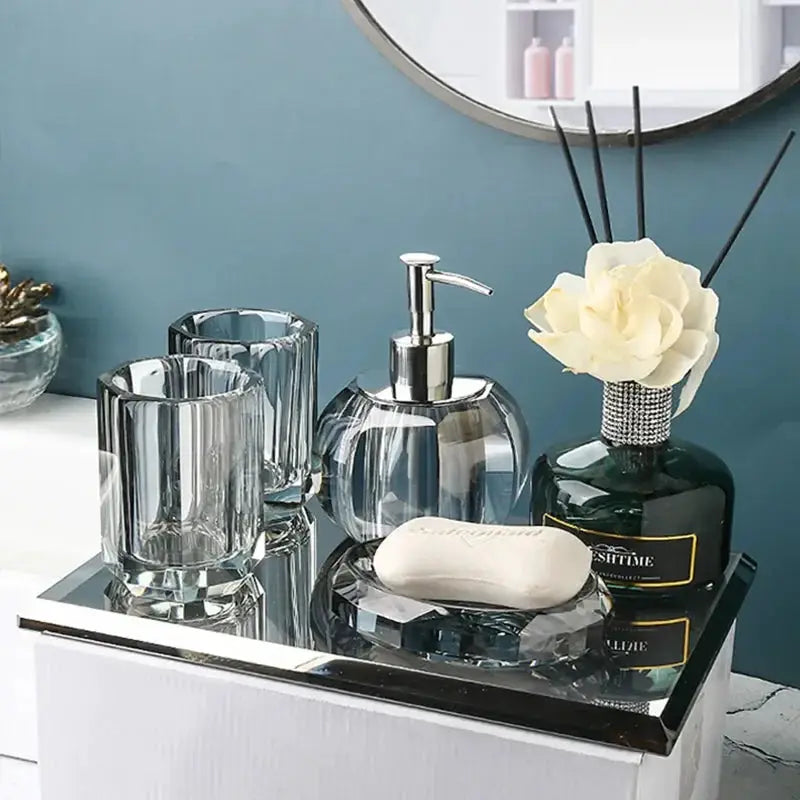 Glass 6-piece bathroom set by Simples Market; clear crystal lotion bottle with pump, toothbrush holder, cup, soap dish.