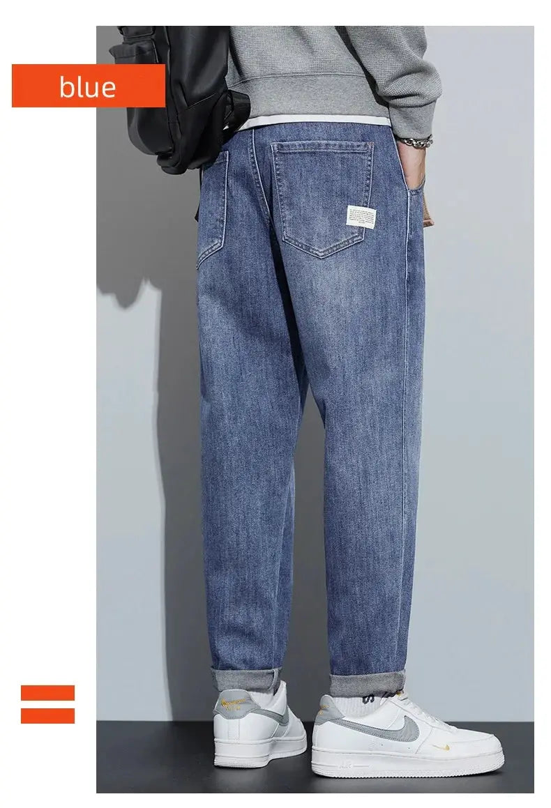 Winter dark blue fleece jeans for men, loose straight fit with rolled cuffs and back pockets.