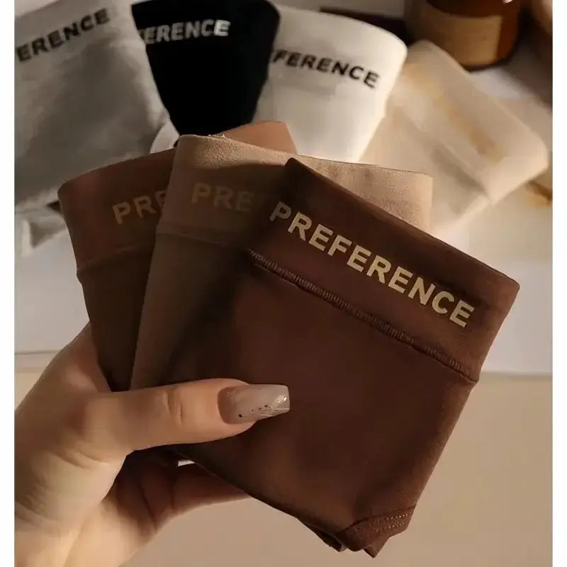 Women's cotton mid-waist briefs in warm tan and brown tones with PREFERENCE waistband; multiple pairs visible