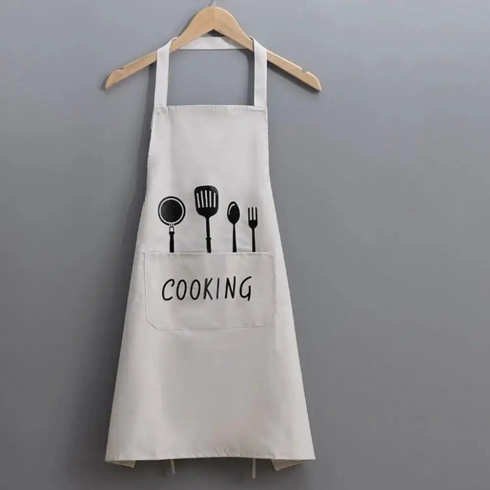 Apron cream linen-look fabric with black utensil print and front pocket.