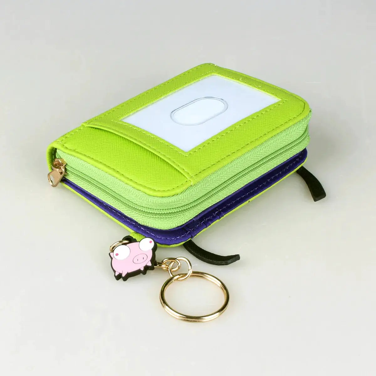 Trifold wallet with ID window in lime green and purple, includes pig keychain (2 items)