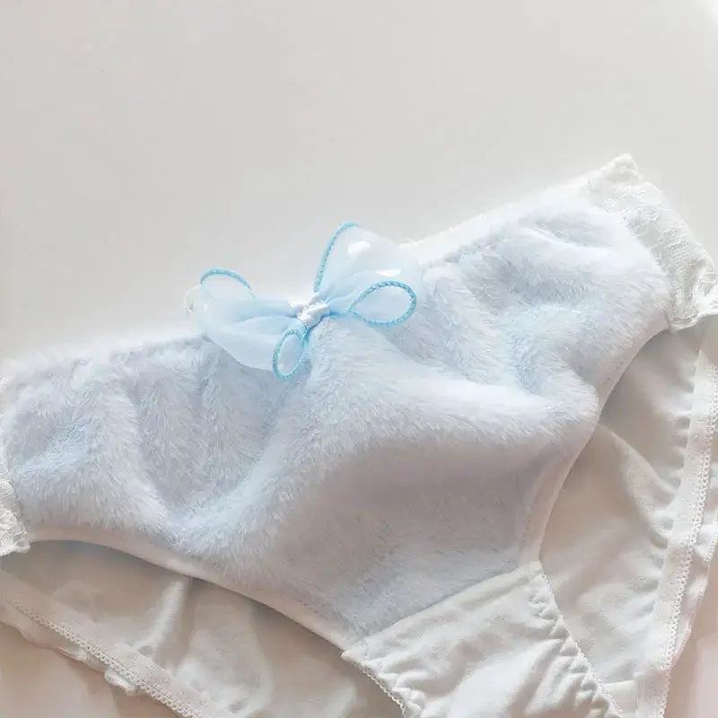 Women’s light blue cotton panties with lace trim and bow, plush fabric