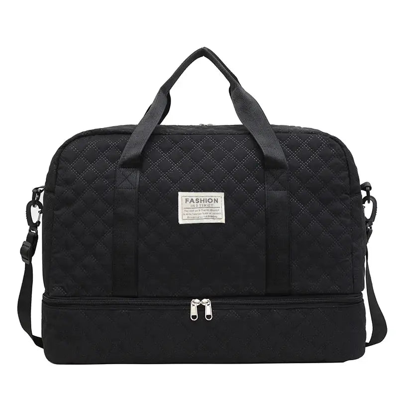 Duffle bag by Simples Market, black quilted fabric with top handles and detachable strap, fashion emblem.