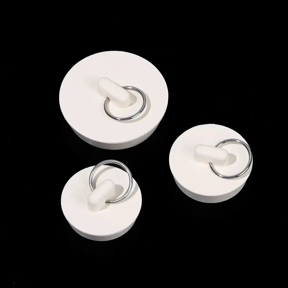 Drain stopper set: three white rubber stoppers with metal rings