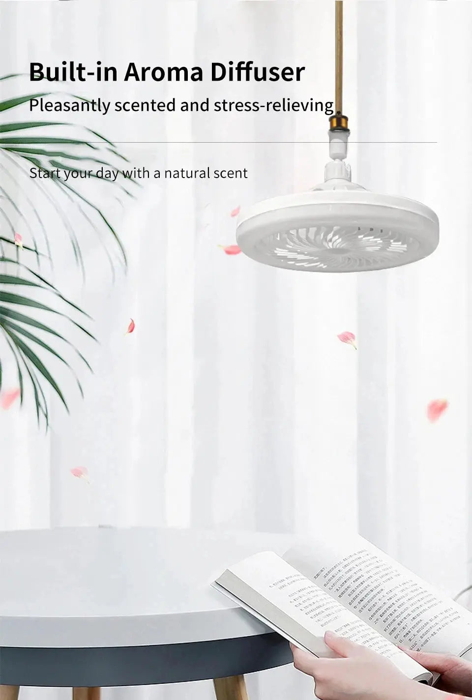 Ceiling fan lamp, white, hanging over a round table with an open book.