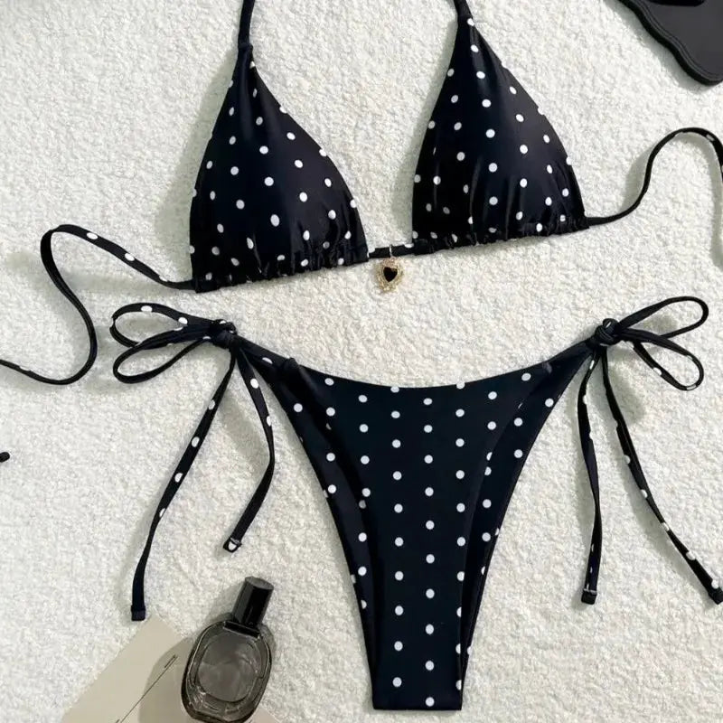 2-piece black bikini set with white polka dots, triangle top and tie-side bottoms