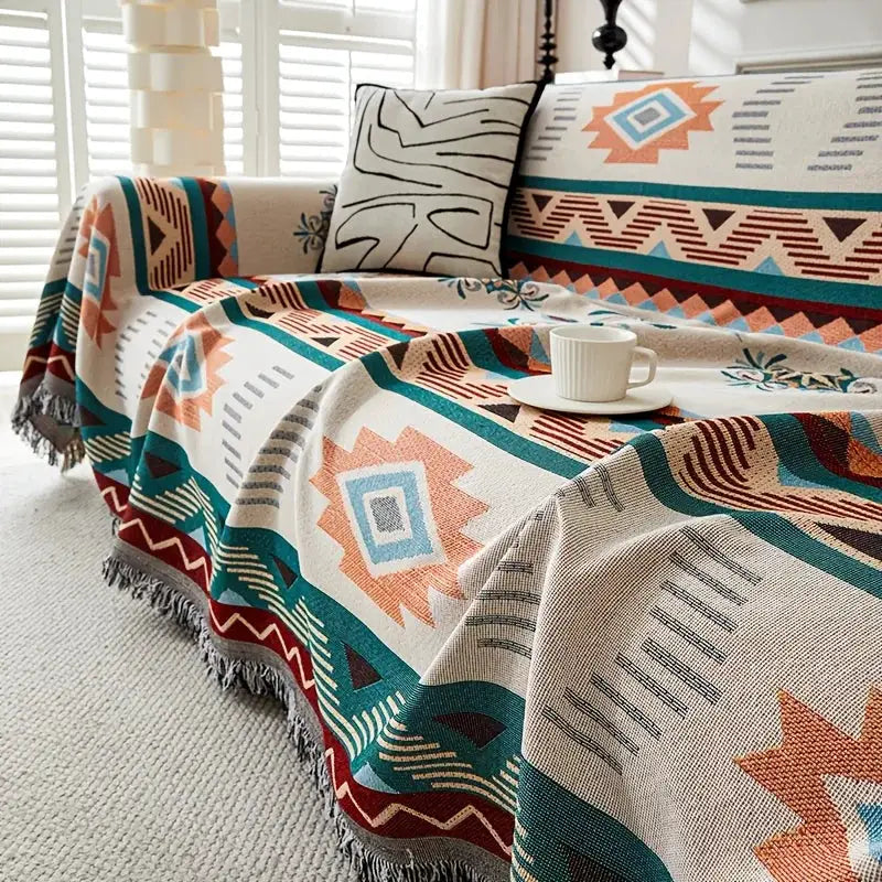 Ethnic sofa cover throw blanket in teal, orange and beige geometric pattern; double-faced, pet-friendly.