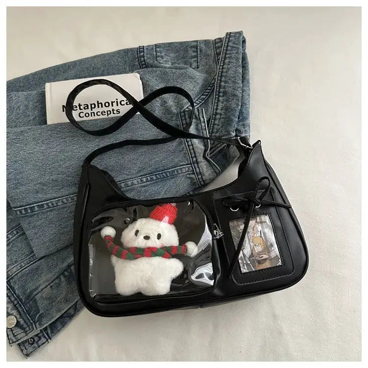 Y2K Harajuku ita bag crossbody in black faux leather with clear window showing a plush teddy in a scarf