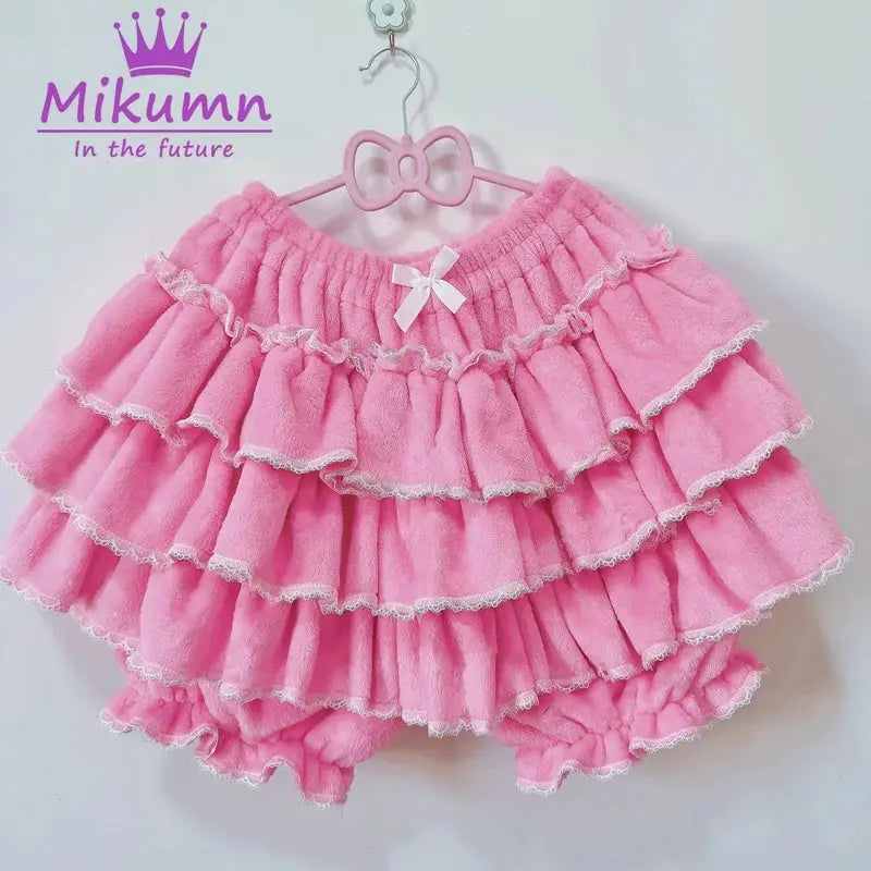 Pink plush lantern shorts with white lace trim and bow, Mikumm logo