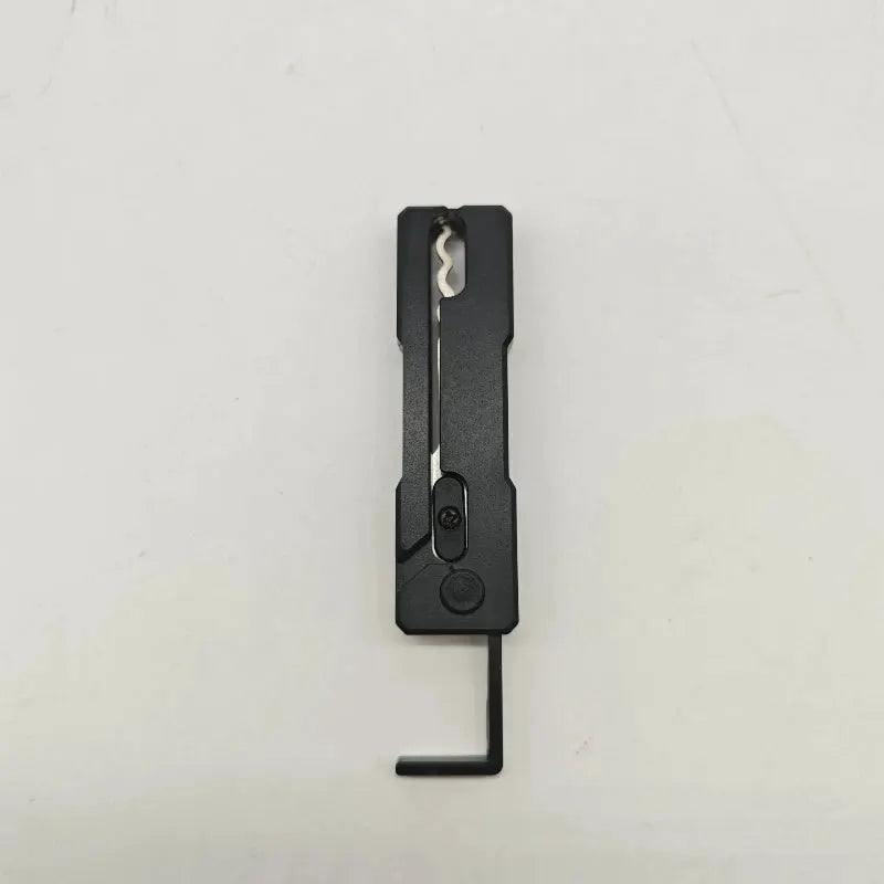 Grav Pick multi-tool by Simples Market, black stainless steel compact folding tool with an L-shaped hex key.