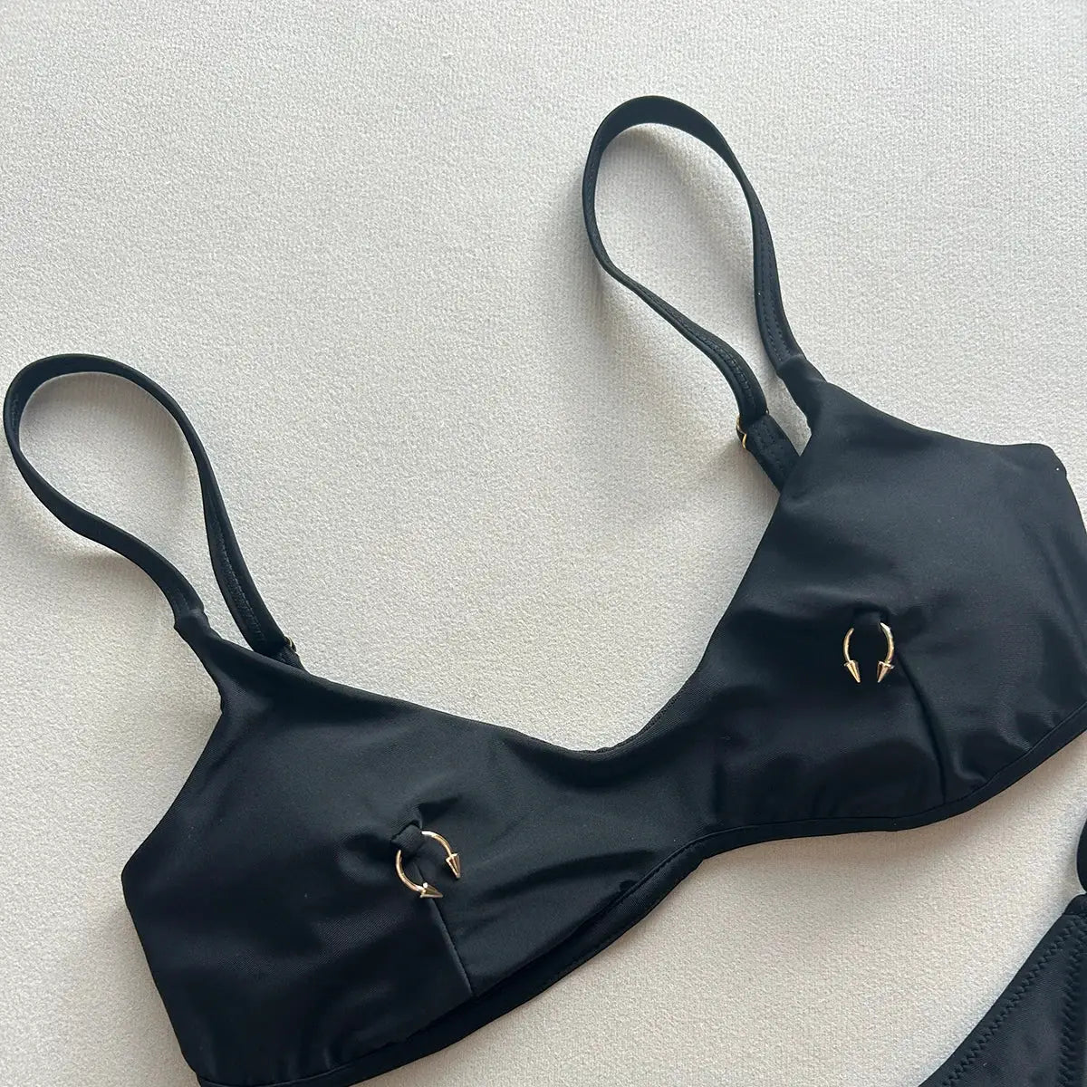 Simples Market black push-up bikini top with gold ring accents and adjustable straps