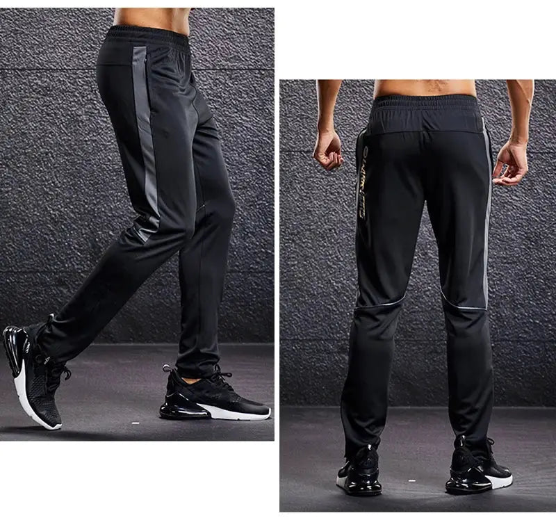 Men's sport pants with zipper pockets, black with gray side panels, jogger-style.