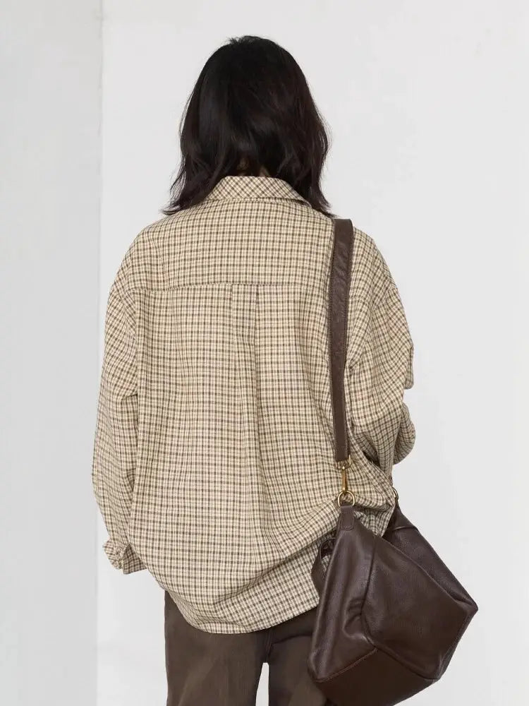 Women’s beige plaid shirt with loose fit and brown crossbody bag