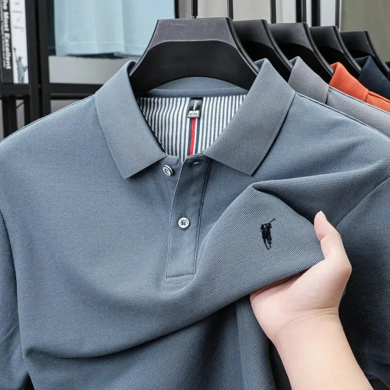 Polo shirt, 100% cotton, muted blue with Paul Pony embroidery; short sleeves.