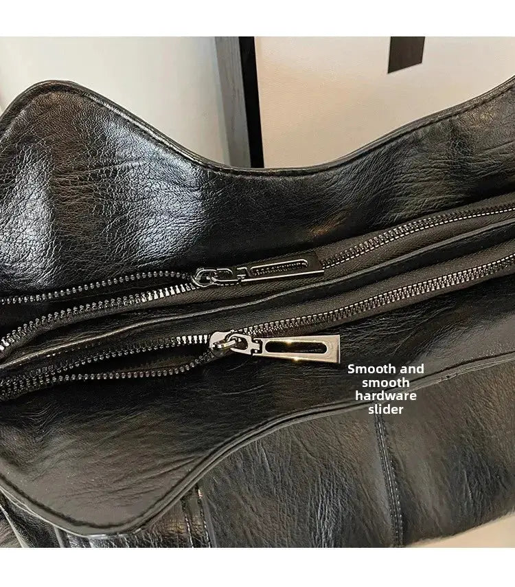 Black PU leather shoulder bag with dual zippers and smooth hardware sliders