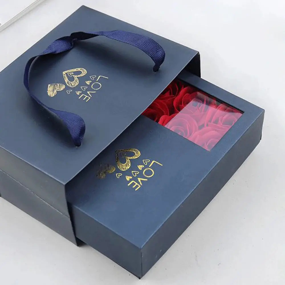 Jewelry box navy blue with rose window showing red roses and blue ribbon.
