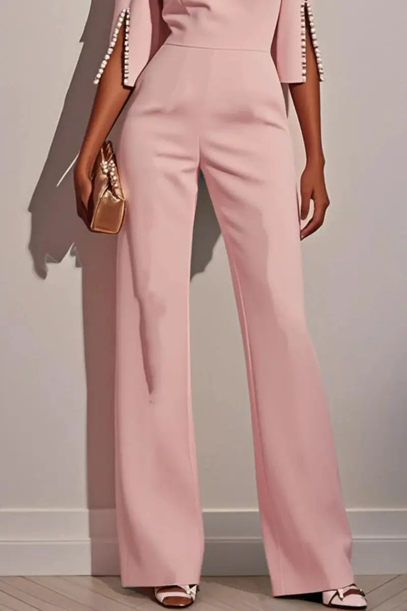 Women's pink jumpsuit with high waist and wide legs; 3/4 sleeves with beaded cuffs