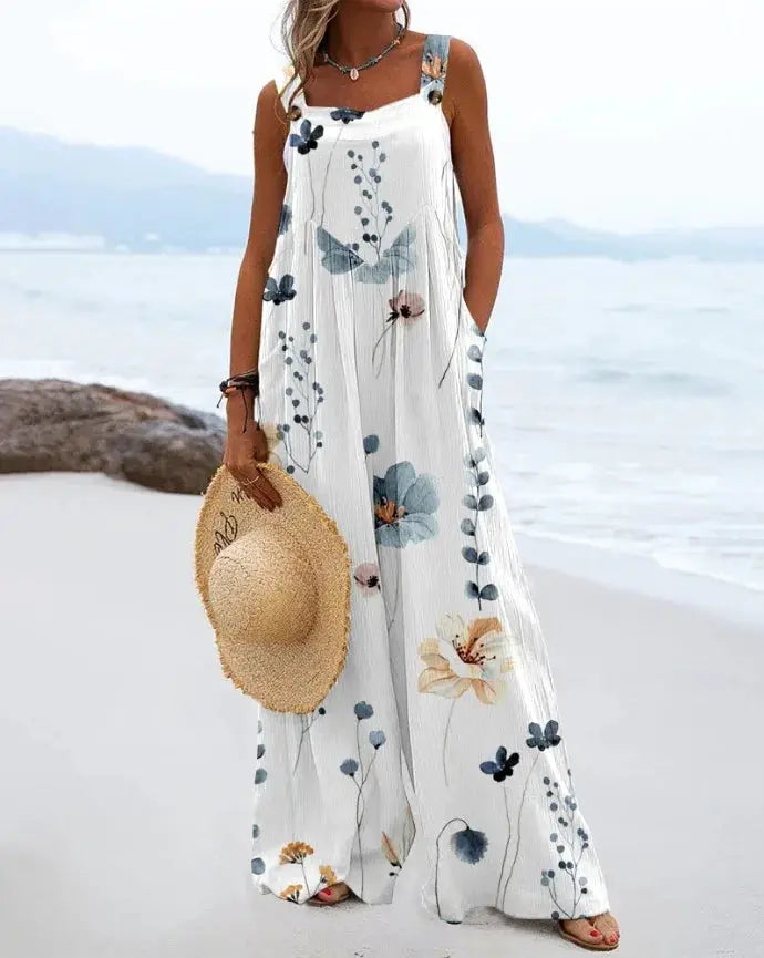 Simples Market vintage print sleeveless jumpsuit in white with blue floral pattern and loose wide-leg silhouette