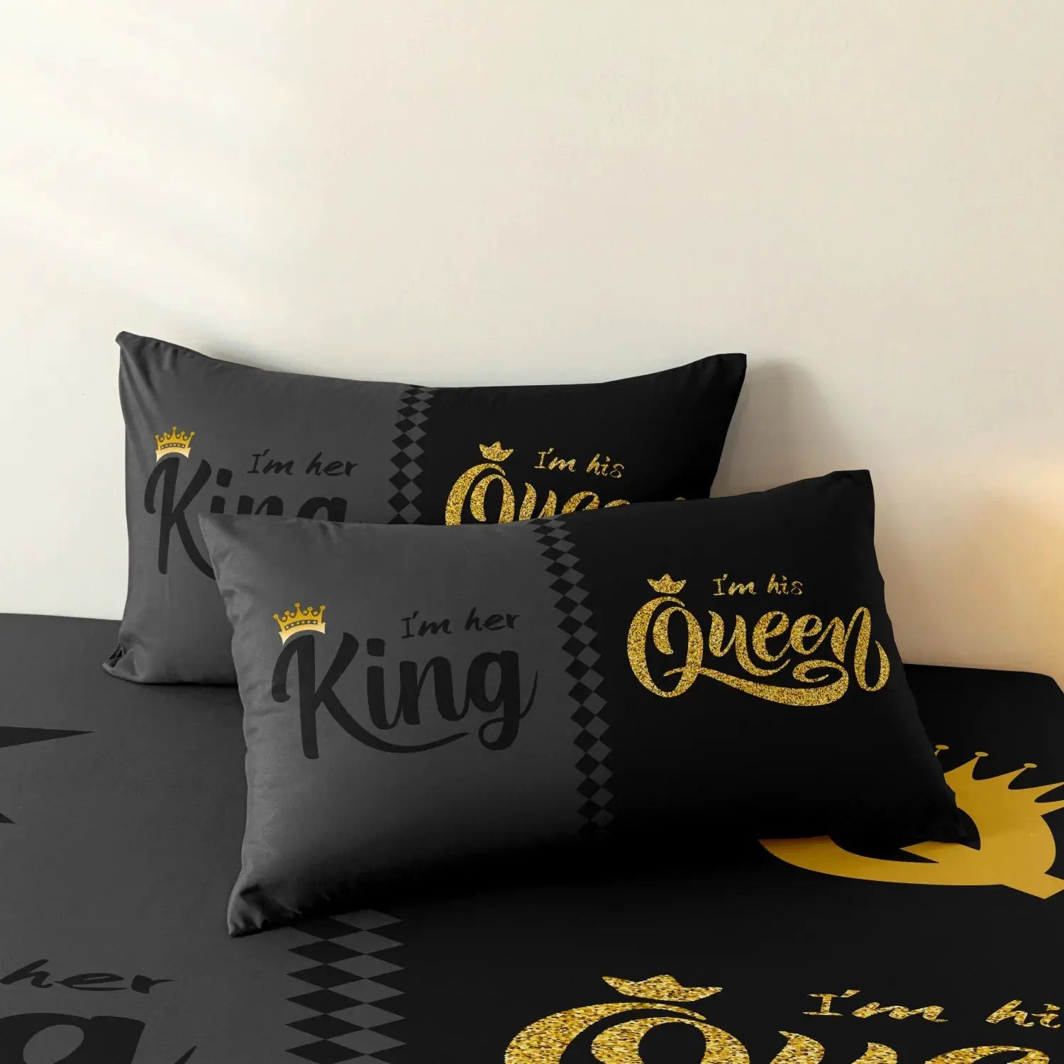 3-piece duvet cover set in black and gray with crown-printed Queen and King text on pillows.