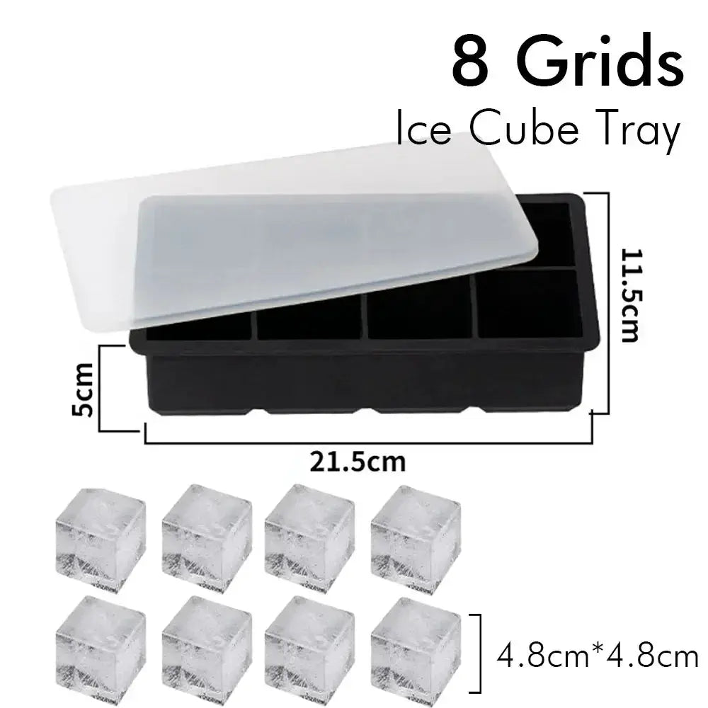 8-grid silicone ice cube tray with lid in black, eight clear 4.8 cm ice cubes shown