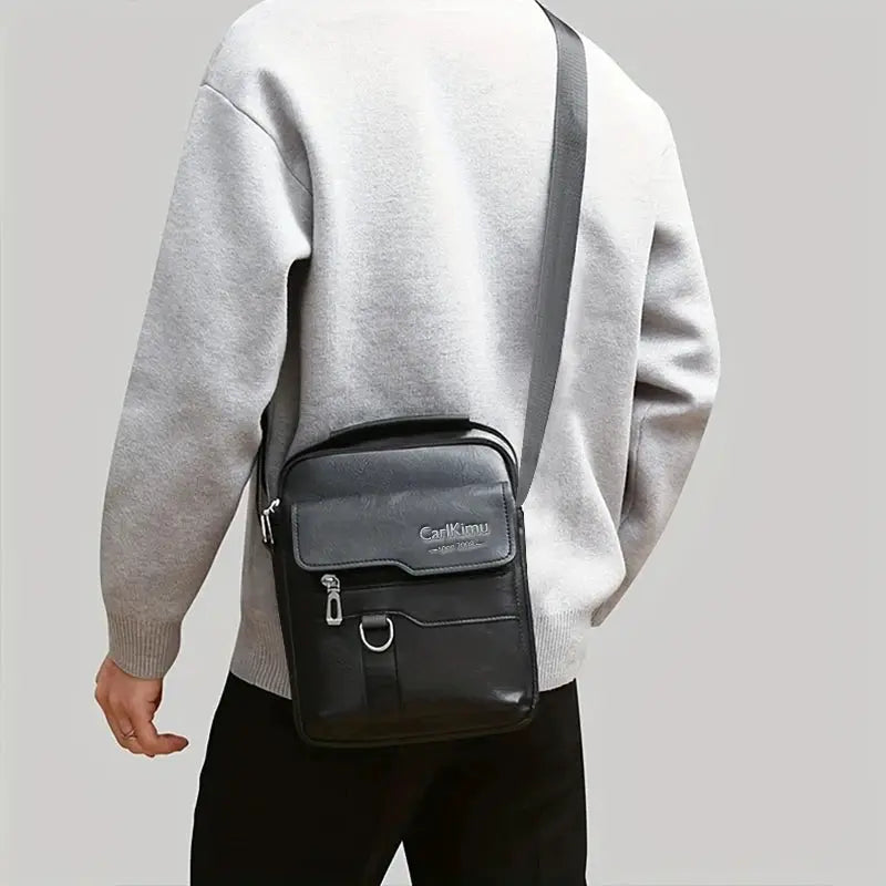 PU leather messenger bag crossbody with gray flap, black body, CarlKimu logo
