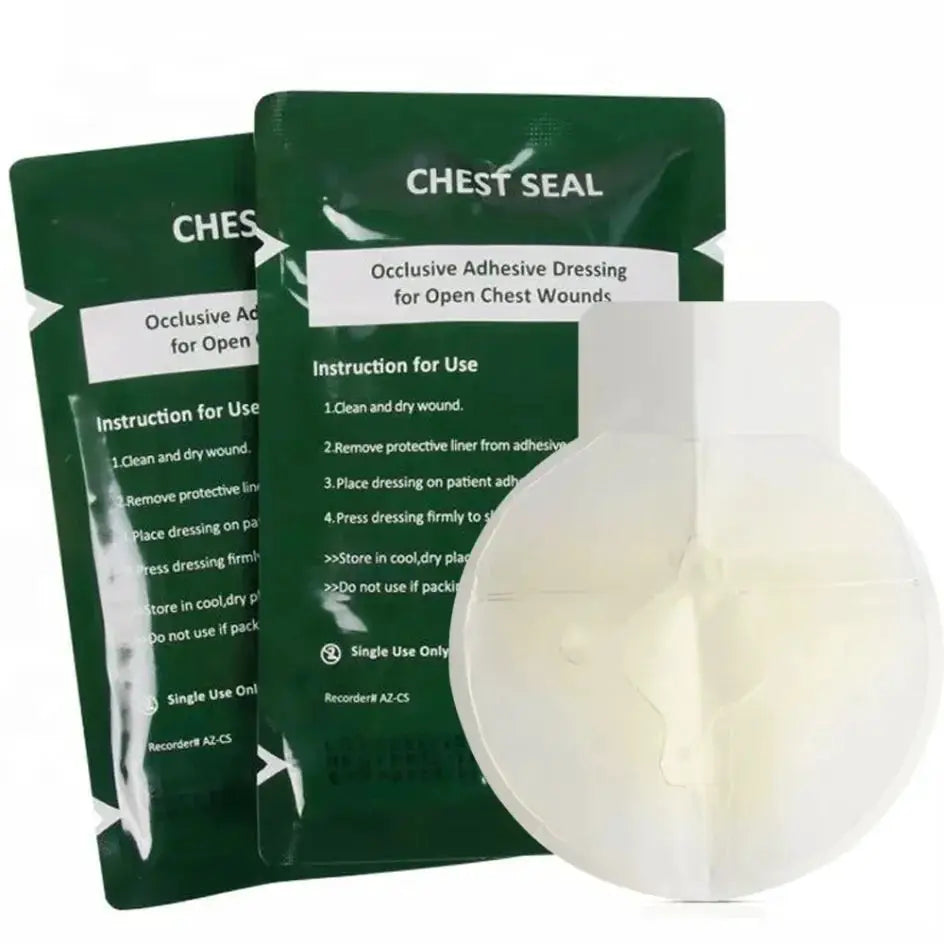 Chest seal kit with two green occlusive dressing packets and a white circular chest seal device.