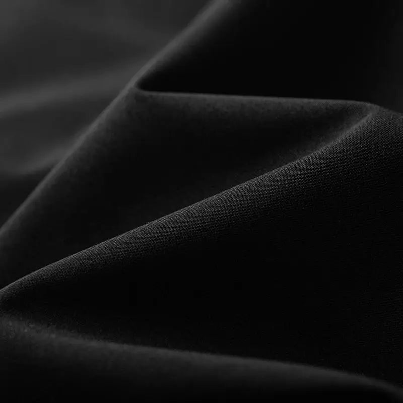 JNLN windbreaker fabric close-up in black, waterproof single-layer material
