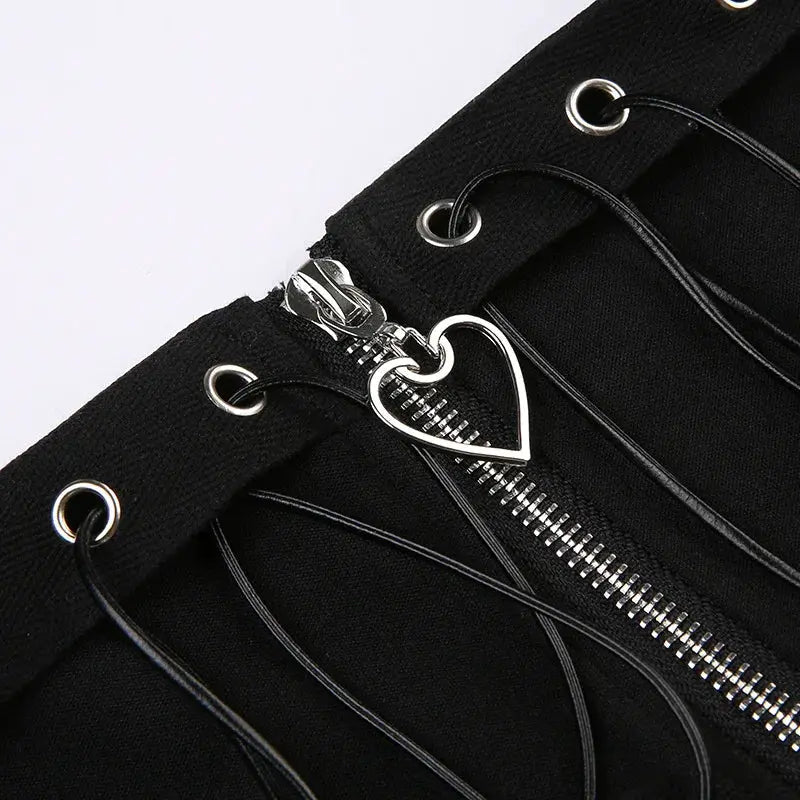 Gothic skater high-waist mini skirt in black with front silver zipper and lace-up detailing, heart zipper pull