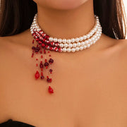 Multilayer three-strand vintage red-blood imitation pearl tassel necklace with white faux pearls and red bead tassels