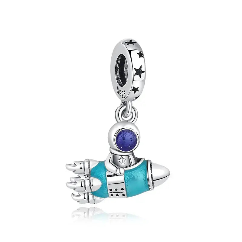 Rocket spaceship charm in 925 sterling silver with turquoise enamel and purple glass orb