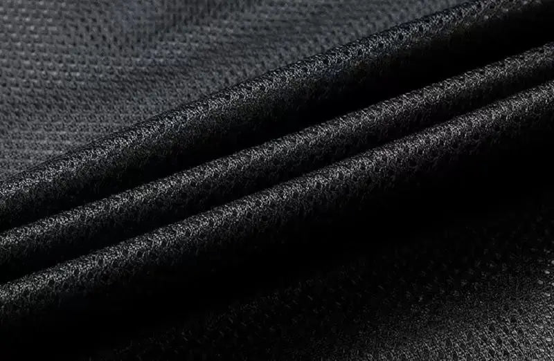 Men's waterproof rain jacket fabric close-up in black