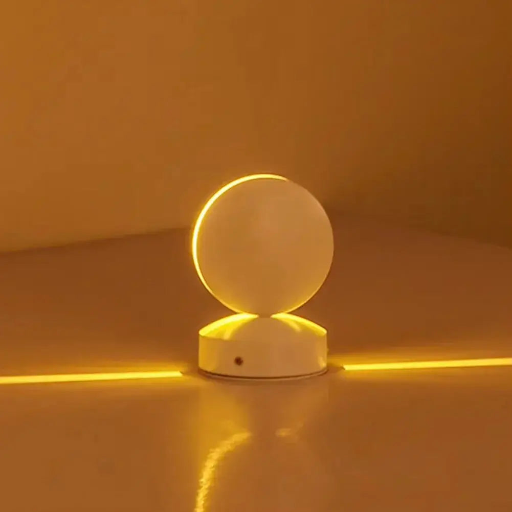 9W LED window-sill lamp with round white globe atop a white base, emitting warm amber light with rotatable angle.