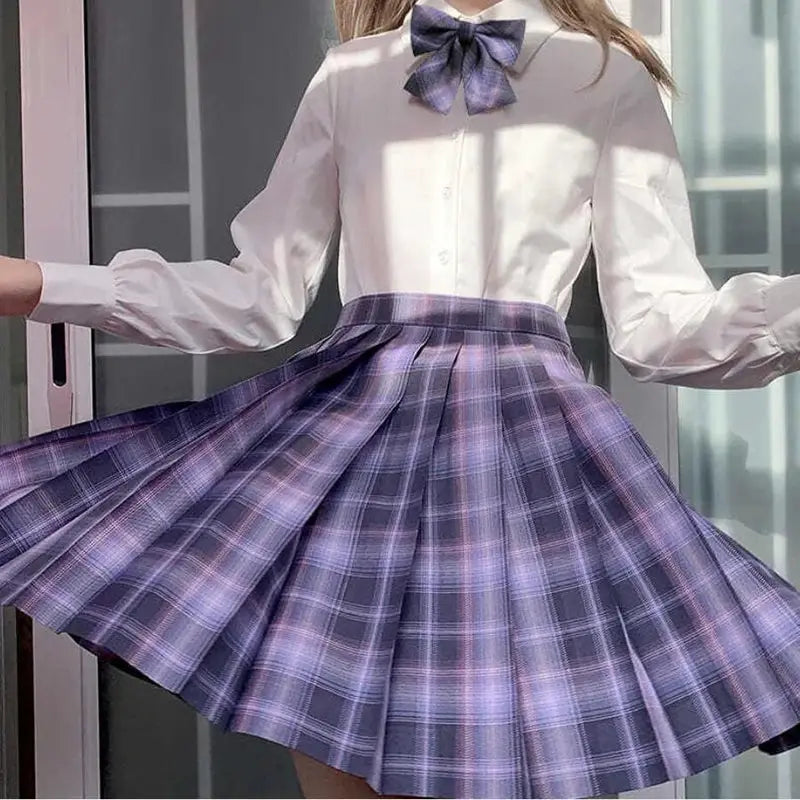 ZOKI plaid pleated skirt with high waist, paired with white blouse and purple bow