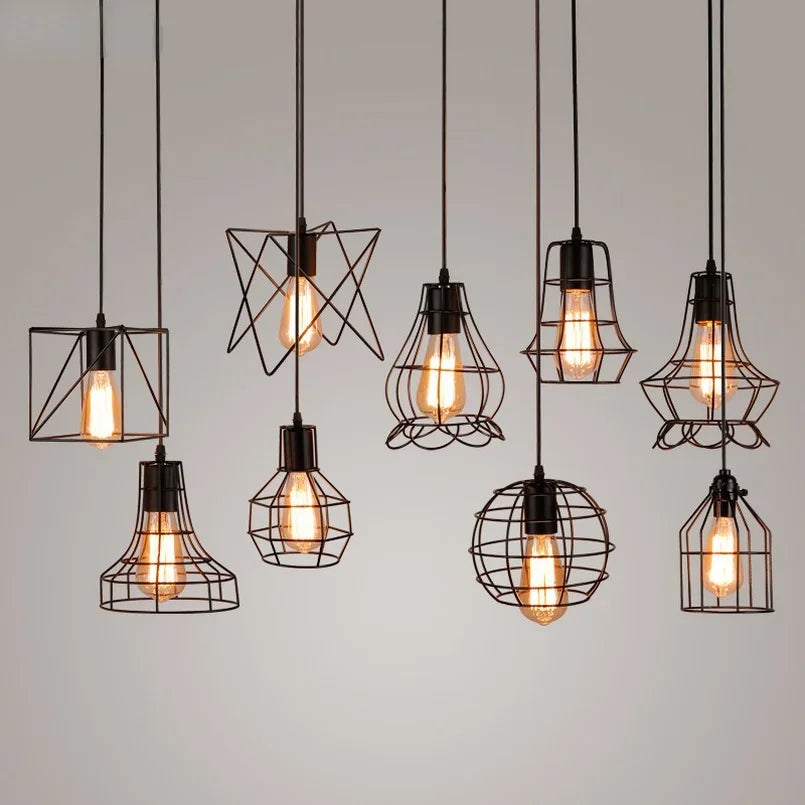 Set of industrial retro black iron pendant lights with varied cage shades and Edison bulbs for dining room kitchen loft