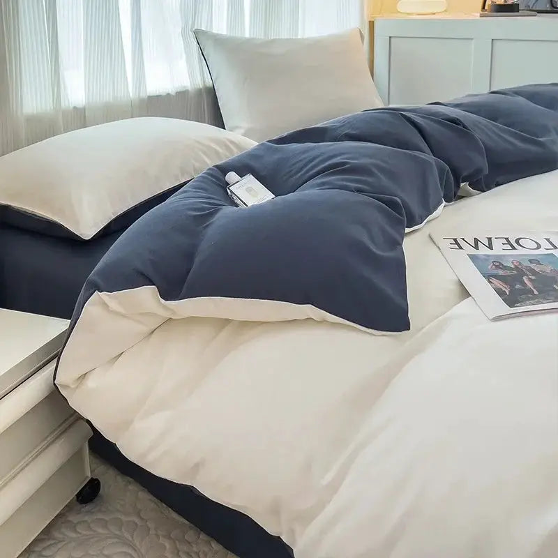 4-piece brush-fabric duvet cover bedding set in navy blue with white underside and pillowcases
