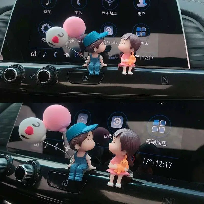 Car dashboard figurines set with two cute cartoon couple figures and a pink balloon ornament
