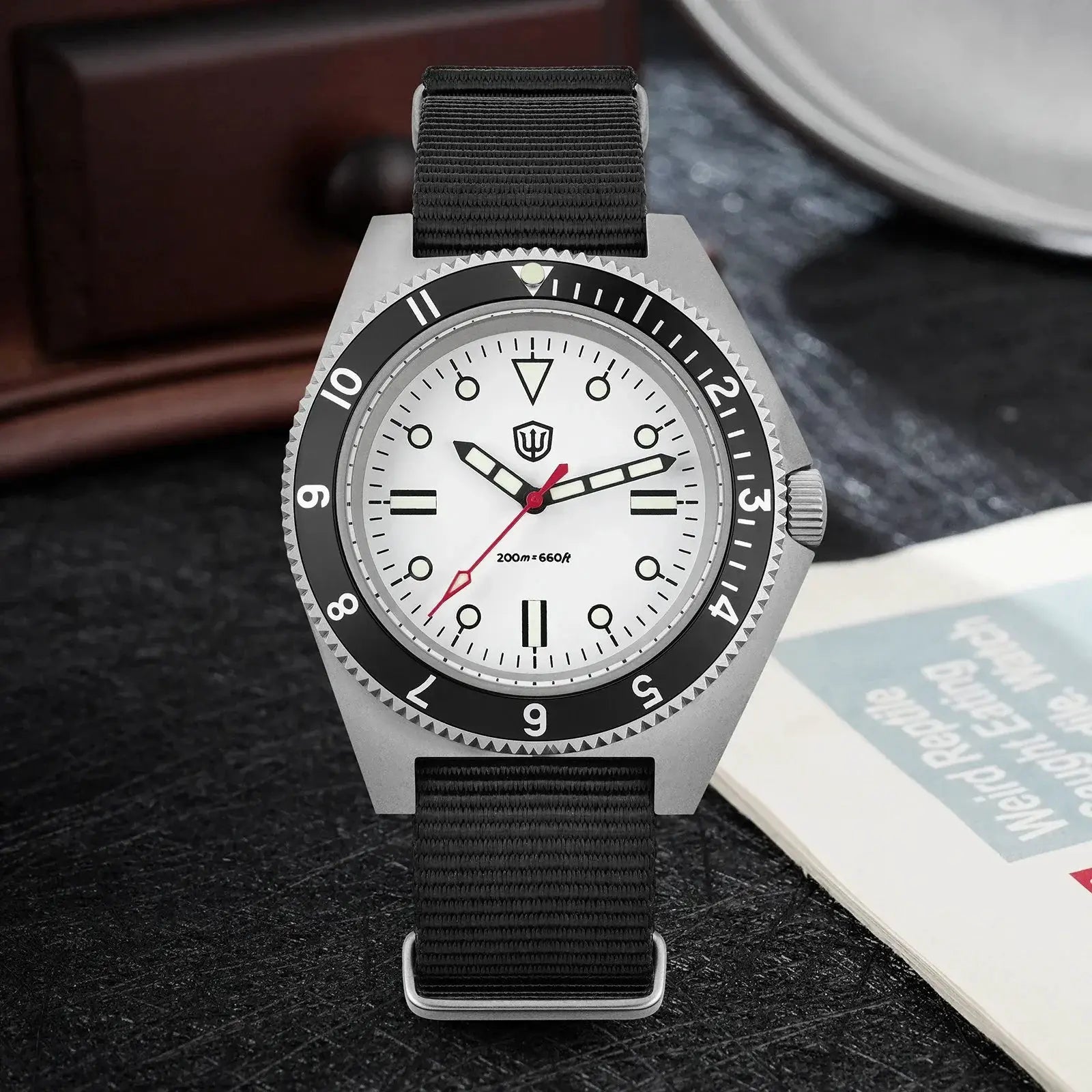 Watchdives WD1972 quartz diver watch with white dial, black bezel, luminous markers, and black NATO strap