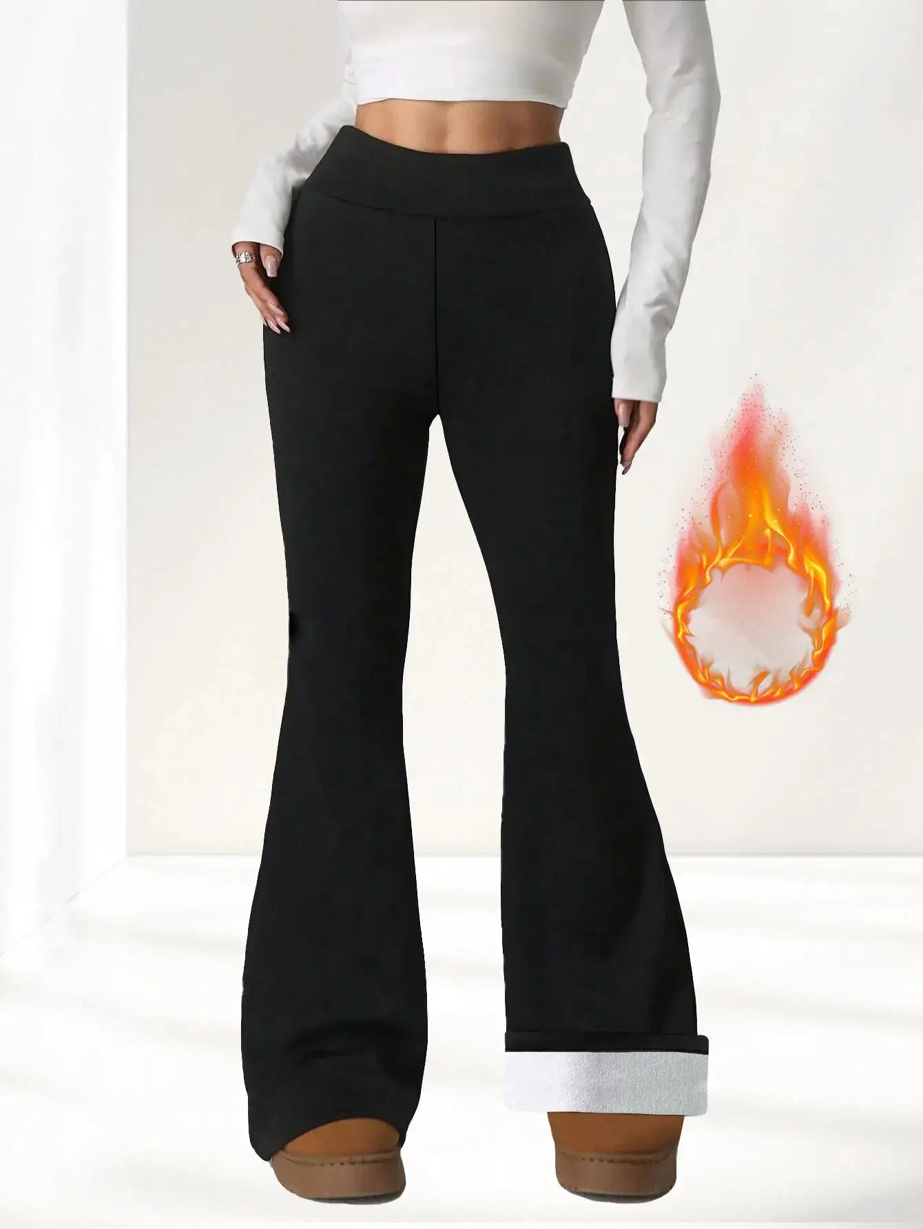 Women's black wool-lined bell-bottom pants with plush lining and rolled cuffs.